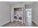 Convenient laundry room with washer, dryer, and shelving for organized storage solutions at 5604 Bobcat Rd, Chapel Hill, NC 27516