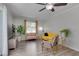 Bright living room with gray walls, vinyl floor, and a comfortable seating area with a yellow sofa at 5604 Bobcat Rd, Chapel Hill, NC 27516