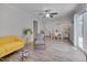 Open-concept living and dining area with gray walls, vinyl floors, and sliding glass door access to outdoor space at 5604 Bobcat Rd, Chapel Hill, NC 27516