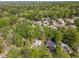 Aerial view of neighborhood with mature trees and a glimpse of multiple roof tops at 601 E Dynasty Dr, Cary, NC 27513