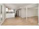Basement featuring a full kitchen, light hard wood floors, and access to the backyard at 601 E Dynasty Dr, Cary, NC 27513