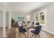 Dining room with wood floors, modern decor, and a walk out to the yard at 601 E Dynasty Dr, Cary, NC 27513