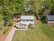Charming two-story home features a well-manicured lawn, privacy fence, and inviting curb appeal with lush, mature trees at 601 E Dynasty Dr, Cary, NC 27513