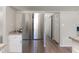 Kitchen with stainless steel fridge, granite countertops, and bright lighting at 601 E Dynasty Dr, Cary, NC 27513