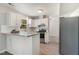 Bright kitchen with white cabinets, stainless steel appliances, and granite countertops at 601 E Dynasty Dr, Cary, NC 27513