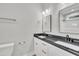 Bathroom featuring double vanity with black countertop, and stylish fixtures at 617 Ray St, Selma, NC 27576