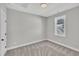 Neutral bedroom with plush carpet, white trim, and a window for natural light at 617 Ray St, Selma, NC 27576