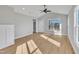 Bright living room featuring vaulted ceiling, ceiling fan and new windows that let in tons of natural light at 617 Ray St, Selma, NC 27576