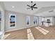 Bright living room with hardwood floors, vaulted ceiling, and open floor plan leading to the kitchen at 617 Ray St, Selma, NC 27576