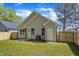 Exterior rear view of house and fenced back yard at 619 Ray St, Selma, NC 27576