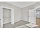 Bedroom with closet and door, bathed in sunlit space at 619 Ray St, Selma, NC 27576