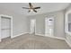 Spacious bedroom features neutral walls, ceiling fan, and ensuite bathroom at 619 Ray St, Selma, NC 27576