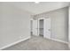 Bedroom showcases neutral walls, carpet, and a closet, creating a cozy and functional space at 619 Ray St, Selma, NC 27576