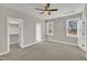 Spacious bedroom with closet, ceiling fan, and natural light at 619 Ray St, Selma, NC 27576