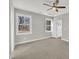 Bright bedroom with ample natural light, plush carpet, and neutral color scheme at 619 Ray St, Selma, NC 27576