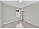 Bedroom features neutral walls, carpet, and a closet, offering a serene and comfortable space at 619 Ray St, Selma, NC 27576