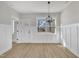 Bright dining room features paneled walls, wood floors, and modern light fixture at 619 Ray St, Selma, NC 27576