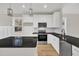 Modern kitchen with stainless steel appliances, granite countertops, and ample cabinet space at 619 Ray St, Selma, NC 27576