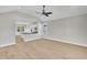 Open-concept living room with hardwood floors and views into the kitchen at 619 Ray St, Selma, NC 27576