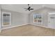 Spacious living room with ample natural light, luxury vinyl plank flooring, and gray walls at 619 Ray St, Selma, NC 27576