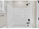 Bathtub with shower and new white surround at 619 Ray St, Selma, NC 27576