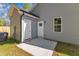 Rear exterior view with access doors to the backyard and building at 621 Ray St, Selma, NC 27576