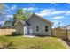 Rear exterior view of the house, showcasing the backyard and its landscaping at 621 Ray St, Selma, NC 27576