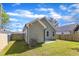 Back exterior view of the house, highlighting its siding and outdoor space at 621 Ray St, Selma, NC 27576
