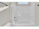 Bathroom featuring white ceramic bathtub and shower combination with updated faucet at 621 Ray St, Selma, NC 27576