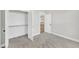 Carpeted bedroom with bright, natural light and an ensuite closet and bathroom at 621 Ray St, Selma, NC 27576