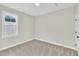 Bedroom with a bright window and neutral wall color at 621 Ray St, Selma, NC 27576