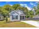 Charming exterior view of this light blue home, featuring a well-manicured lawn and inviting facade at 621 Ray St, Selma, NC 27576