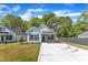 Charming exterior view of this light blue home, featuring a well-manicured lawn and inviting facade at 621 Ray St, Selma, NC 27576
