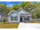 Charming exterior view of this light blue home, featuring a well-manicured lawn and inviting facade at 621 Ray St, Selma, NC 27576