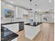 Kitchen with granite countertops, an island with seating, and stainless steel appliances in an open layout at 621 Ray St, Selma, NC 27576