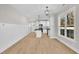 Open layout with a modern kitchen, including a center island and sleek floors at 621 Ray St, Selma, NC 27576