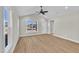 Inviting living room with sleek floors and a vaulted ceiling providing lots of natural light at 621 Ray St, Selma, NC 27576