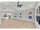Open-concept living room with plenty of natural light and seamless flow into the modern kitchen at 621 Ray St, Selma, NC 27576