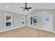 Bright living room featuring sleek floors, recessed lighting, and natural light from multiple windows at 621 Ray St, Selma, NC 27576