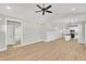 Spacious living room featuring sleek floors, connecting to a bathroom and kitchen at 621 Ray St, Selma, NC 27576