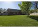 Expansive backyard with lush green lawn and mature shade trees at 627 Carraway Dr, Graham, NC 27253