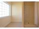 Bathroom featuring a walk-in shower and natural light from a window at 627 Carraway Dr, Graham, NC 27253