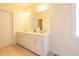 Bathroom with white double vanity and large mirror at 627 Carraway Dr, Graham, NC 27253