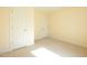 Neutral bedroom featuring carpet, two doors and off-white walls and trim at 627 Carraway Dr, Graham, NC 27253
