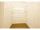Walk-in closet with full of shelving and carpet at 627 Carraway Dr, Graham, NC 27253