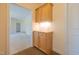 Entryway featuring built-in wooden cabinet and light fixtures at 627 Carraway Dr, Graham, NC 27253