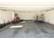 Spacious garage with high ceilings, lift, and room for vehicles and equipment at 627 Carraway Dr, Graham, NC 27253
