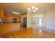 Kitchen open to the dining and living room areas with wood floors and ample light at 627 Carraway Dr, Graham, NC 27253