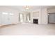 Large front living room featuring fireplace, double front doors, and view into the backyard at 627 Carraway Dr, Graham, NC 27253