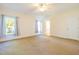 Bright main bedroom with windows, carpet and access to en-suite bathroom at 627 Carraway Dr, Graham, NC 27253